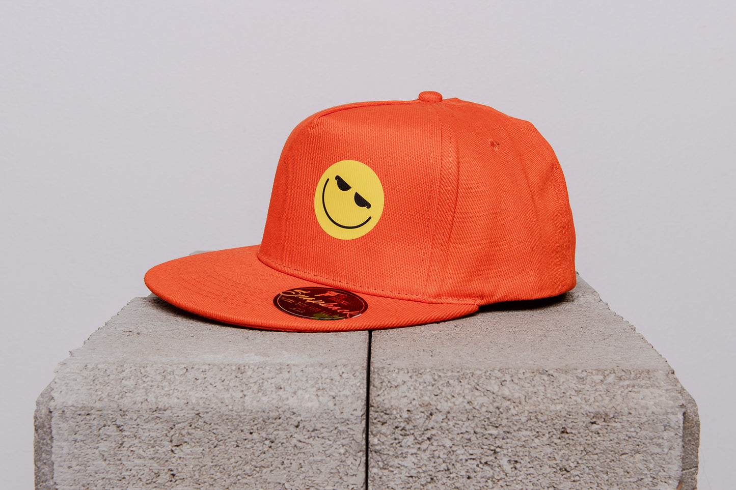 Cap with a smiley face